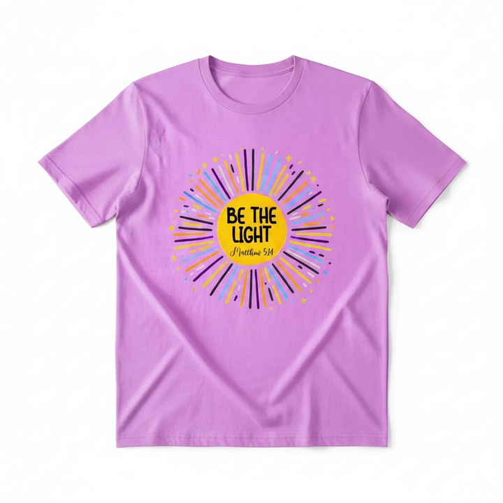 Be The Light Matthew 5:14 sunburst graphic tee with vibrant colors and bold faith message