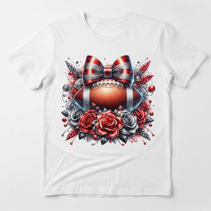 Football Roses Glitter Bow graphic tee with football centerpiece, red and silver glitter bow, and floral design on shimmering silver background