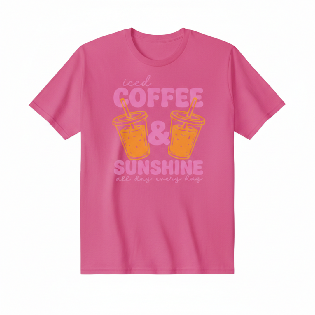 Adorable Coffee Lover Tee featuring bold retro-style pink lettering with two illustrated iced coffee cups, available in hot pink, orange, and white.