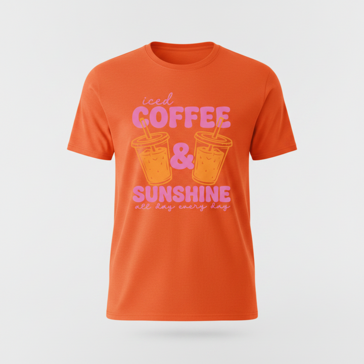 Adorable Coffee Lover Tee featuring bold retro-style pink lettering with two illustrated iced coffee cups, available in hot pink, orange, and white.