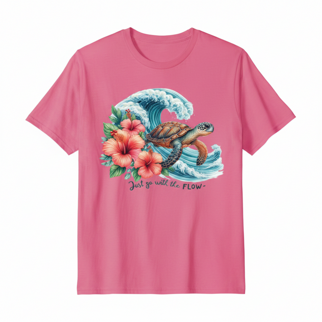 Breathtaking Sea Turtle Graphic Tee featuring a detailed watercolor sea turtle gliding through a dramatic ocean wave with pink hibiscus flowers.