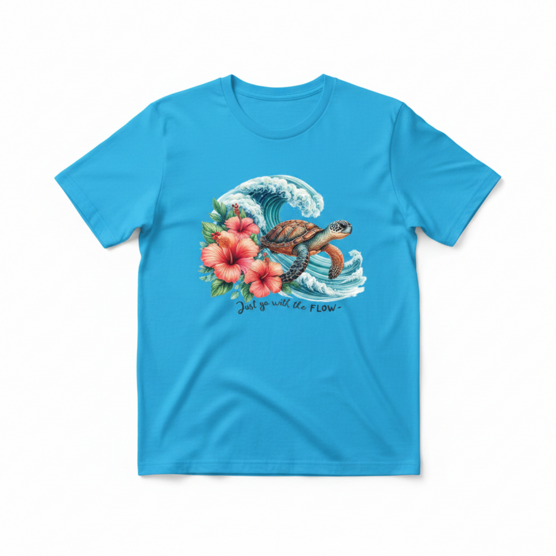 Breathtaking Sea Turtle Graphic Tee featuring a detailed watercolor sea turtle gliding through a dramatic ocean wave with pink hibiscus flowers.