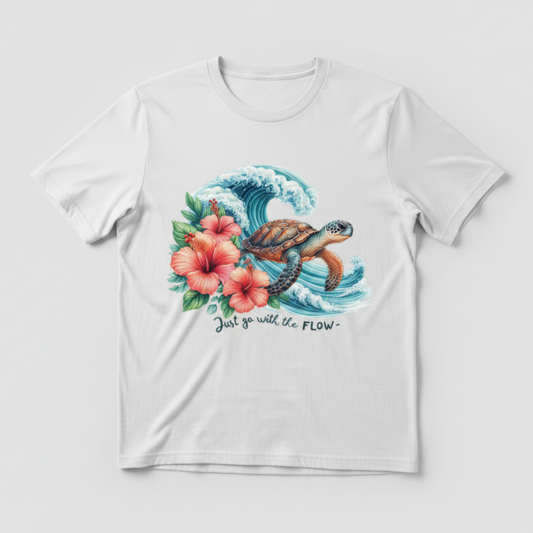 Breathtaking Sea Turtle Graphic Tee featuring a detailed watercolor sea turtle gliding through a dramatic ocean wave with pink hibiscus flowers.
