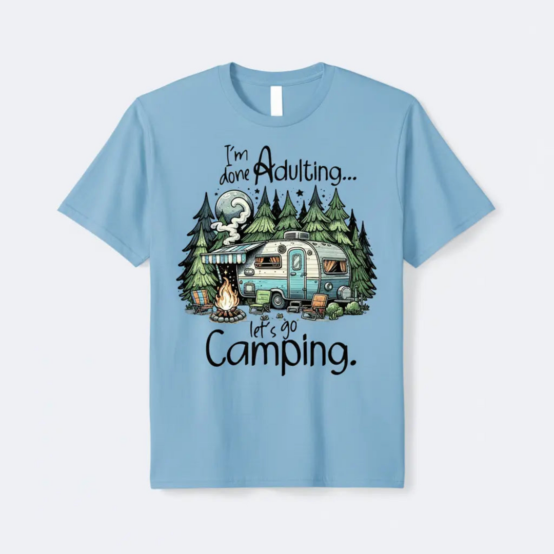 A vibrant Funny Camper Graphic Tee featuring a glowing moon scene and a cozy retro camper trailer illustration