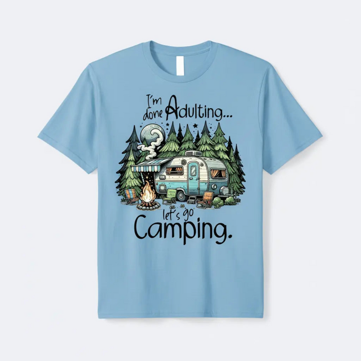 A vibrant Funny Camper Graphic Tee featuring a glowing moon scene and a cozy retro camper trailer illustration